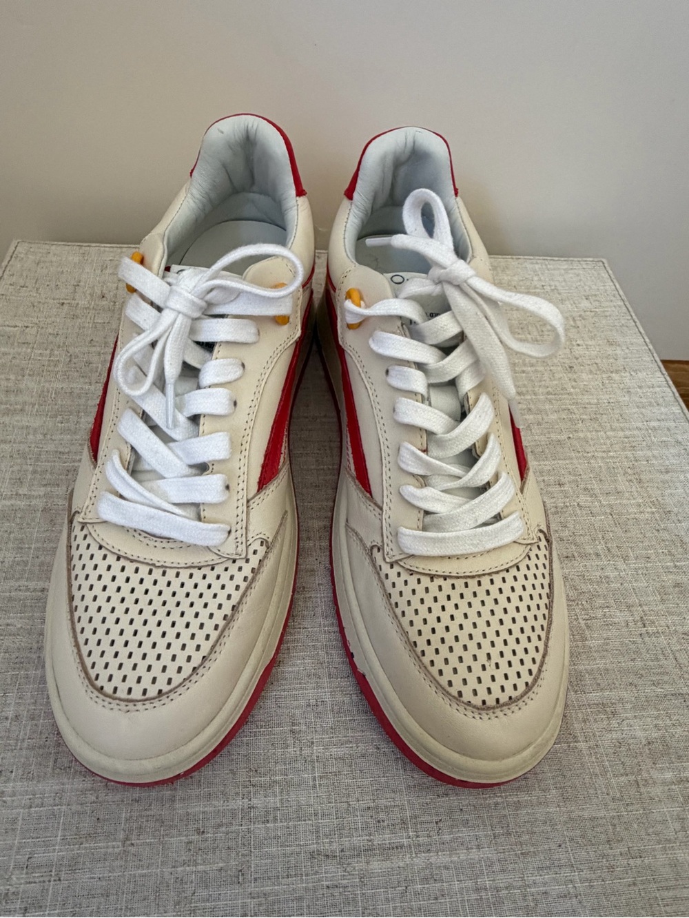Woman’s White and Red Leather Sneakers